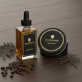 Premium beard oil dropper bottle and beard balm tin on dark wood surface
