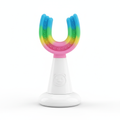 Colorful kids U-shaped silicone toothbrush on white background