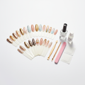 Press on nails set with nail glue, file and prep tools on white background